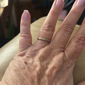 Womens diamond ring. Dainty.  Not sure if it’s 10 or 14k. Hard to get clear pic